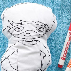 Close up of a Reusable Superhero Coloring Pillow with red washable marker