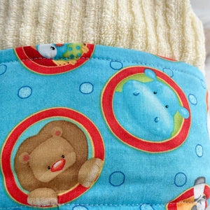 fabric with lion and blue hippo design on a blue background