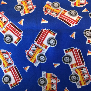 Royal blue fabric with red and yellow firetrucks