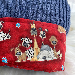 Red fabric with dog pattern and blue textured background