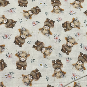 cream fabric with highland calves wearing flower posies