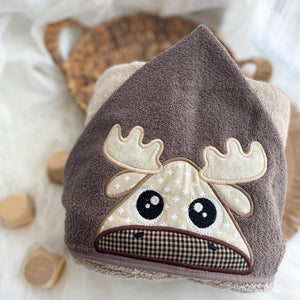 Children's hooded towel with moose design on a soft background