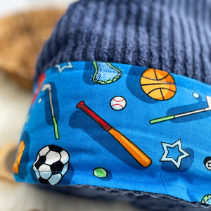 Blue fabric with sports-themed pattern on a blue background