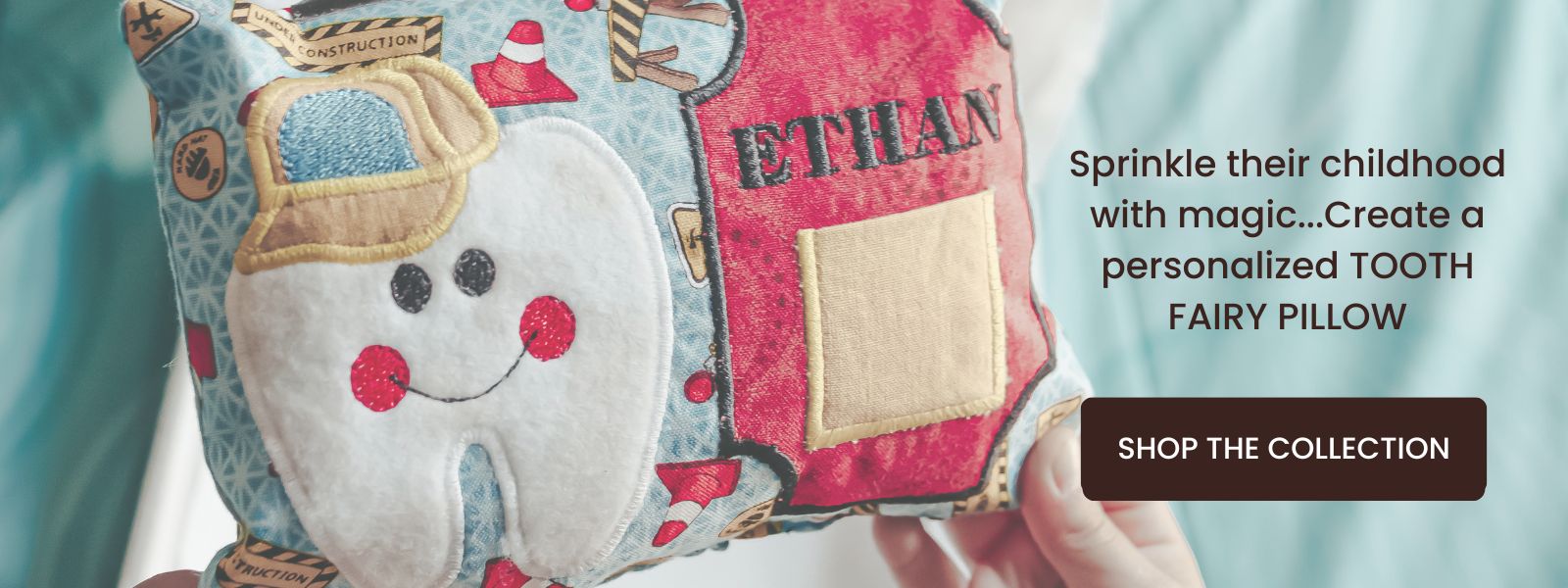 Hand holding a construction theme tooth fairy pillow personalized with the name Ethan